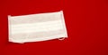Coronavirus medical mask for protection against flu on a red background