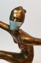 Coronavirus metaphore vintage brass statue dancer girl