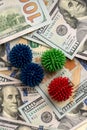 Coronavirus model on the background of hundred-dollar American banknotes. The concept of the impact of the coronavirus epidemic on