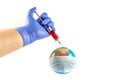 Planet earth in mask and syringe. The globe and vaccination. The World epidemic of coronavirus. Earth Vaccination. An injection