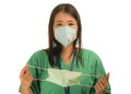 Coronavirus outbreak in China - young beautiful Asian Chinese medicine doctor woman or hospital nurse recommend use of protective Royalty Free Stock Photo