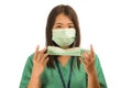 Coronavirus outbreak in China - young beautiful Asian Korean medicine doctor woman or hospital nurse recommend use of protective Royalty Free Stock Photo