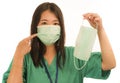 Coronavirus outbreak in China - young beautiful Asian Korean medicine doctor woman or hospital nurse recommend use of protective Royalty Free Stock Photo