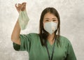 Coronavirus outbreak in China - young beautiful Asian Korean medicine doctor woman or hospital nurse recommend use of protective Royalty Free Stock Photo