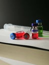 Coronavirus outbreak, Virus and recovery concept, a group of vaccine bottles with empty, red or green liquid and syringe