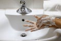 Coronavirus pandemic prevention wash hands with soap warm water Royalty Free Stock Photo