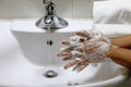 Coronavirus pandemic prevention wash hands with soap warm water,concept To prevent the covid-19 Royalty Free Stock Photo