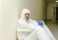 The coronavirus pandemic . A tired, exhausted doctor struggles with the coronavirus in a hospital clinic after a long