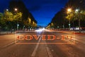 Coronavirus in Paris, France. Covid-19 sign. Concept of COVID pandemic and travel in Europe. Champs-Elysees avenue Royalty Free Stock Photo