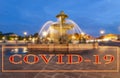 Coronavirus in Paris, France. Covid-19 sign. Concept of COVID pandemic and travel in Europe. Fountain at the Place de la Concorde Royalty Free Stock Photo