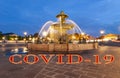 Coronavirus in Paris, France. Covid-19 sign. Concept of COVID pandemic and travel in Europe. Fountain at the Place de la Concorde Royalty Free Stock Photo