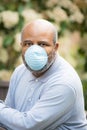 Coronavirus, portrait of African American man outside with protective mask.  Concept of Lockdown, Flatten the Curve, Social Royalty Free Stock Photo