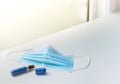 Coronavirus prevention medical surgical mask and isopropyl alcohol spray. Royalty Free Stock Photo