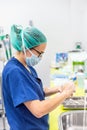 Coronavirus prevention. Nurse washing her hands after treat a patient with Covid-19 infection. Medical sanitizing