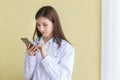 Asian female doctor Using a mobile phone Royalty Free Stock Photo