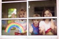 Coronavirus quarantine. Kids at window. Stay home