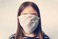 Quarantine No Infection and Stop Coronavirus Concepts. Baby girl child kid covers her face medical protective mask at Royalty Free Stock Photo