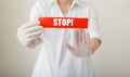 Coronavirus quarantine, red warning sign with text Stop, doctor show stop hands gesture for stop corona virus outbreak. Doctor Royalty Free Stock Photo