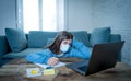 Coronavirus school closures and lockdown. Bored kid with face mask studying online class at home Royalty Free Stock Photo