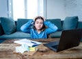 Coronavirus school closures and lockdown. Bored kid with face mask studying online class at home Royalty Free Stock Photo