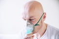 Coronavirus sick man breathing with oxygen mask. Patient in hospital. Royalty Free Stock Photo
