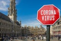 Coronavirus sign against view of Grand Place Grote Markt in Brussels, Belgium. Warning about pandemic in Croatia. Coronavirus