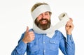 Coronavirus toilet paper shortage. Essential goods. Consumerism. Man hold toilet paper. Hipster Guy having fun. Softness