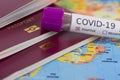 Coronavirus and travel concept. Epidemic in Wuhan, China. World map showing countries with COVID-19 cases. Blood sample in a tube Royalty Free Stock Photo