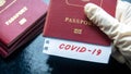 Coronavirus and travel concept. Note COVID-19 coronavirus and passport. Novel corona virus outbreak. Spread of epidemic from China Royalty Free Stock Photo