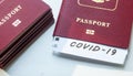 Coronavirus and travel concept. Note COVID-19 coronavirus and passport. Novel corona virus outbreak. Spread of epidemic from China Royalty Free Stock Photo