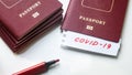 Coronavirus and travel concept. Note COVID-19 and passport. Novel corona virus outbreak. Spread of epidemic from Wuhan, China Royalty Free Stock Photo