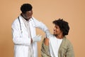 Coronavirus Vaccination Campaign. African American Male Patient Getting Vaccine Injection Against Covid-19 Royalty Free Stock Photo