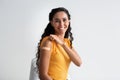 Coronavirus Vaccination. Portrait Of Smiling Vaccinated Lady Demonstrating Arm With Adhesive Bandage