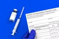 Coronavirus vaccination record card, official doument in doctor`s hand close-up Royalty Free Stock Photo