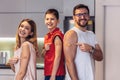 Vaccinated Family Of Three With Adhesive Bandage On Arms Posing At Home After Getting Covid-19 Vaccine