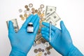 Coronavirus vaccine cost. vaccine ampoule and money. Fight against Covid-19. Pevention  immunization and treatment Royalty Free Stock Photo