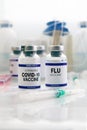 Flu and Covid-19 vaccine vials for booster shot for covid and Influenza virus