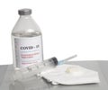 Coronavirus Vaccine injection vials medicine drug bottle Covid-19 with syringe and medical mask Royalty Free Stock Photo