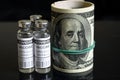 Coronavirus vaccine vials and rolled dollar bills