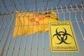 Coronavirus warning sign on the barbed wire fence against flag of New Mexico. COVID-19 quarantine related 3D rendering