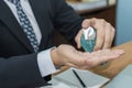 Coronavirus. young businessman in black suit hands washing with alcohol gel for clean corona virus