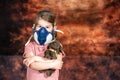 Coronovirus Quarantine, Stay Home Concept. Covid-19 pandemic. Little girl Wearing Gas Mask