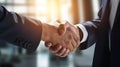 Corporate Agreement: Close-Up of Morning Handshake in Office Lobby