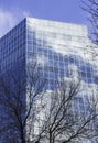 Corporate business glass building reflecting the sky and clouds Royalty Free Stock Photo