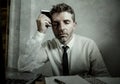 Corporate business lifestyle portrait of stressed and exhausted businessman working frustrated at office computer desk overworked Royalty Free Stock Photo