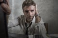 Corporate business lifestyle portrait of stressed and exhausted businessman working frustrated at office computer desk overworked Royalty Free Stock Photo