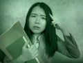 Corporate business stress portrait of young attractive upset and stressed executive Asian Korean woman tired and unhappy holding Royalty Free Stock Photo