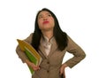 Corporate business stress portrait of young attractive upset and stressed executive Asian Korean woman tired and unhappy holding Royalty Free Stock Photo