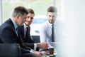 Corporate business team meeting in a modern open plan office Royalty Free Stock Photo