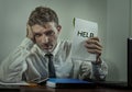 Corporate business worker in stress - young attractive stressed and desperate businessman holding help sign overworked and